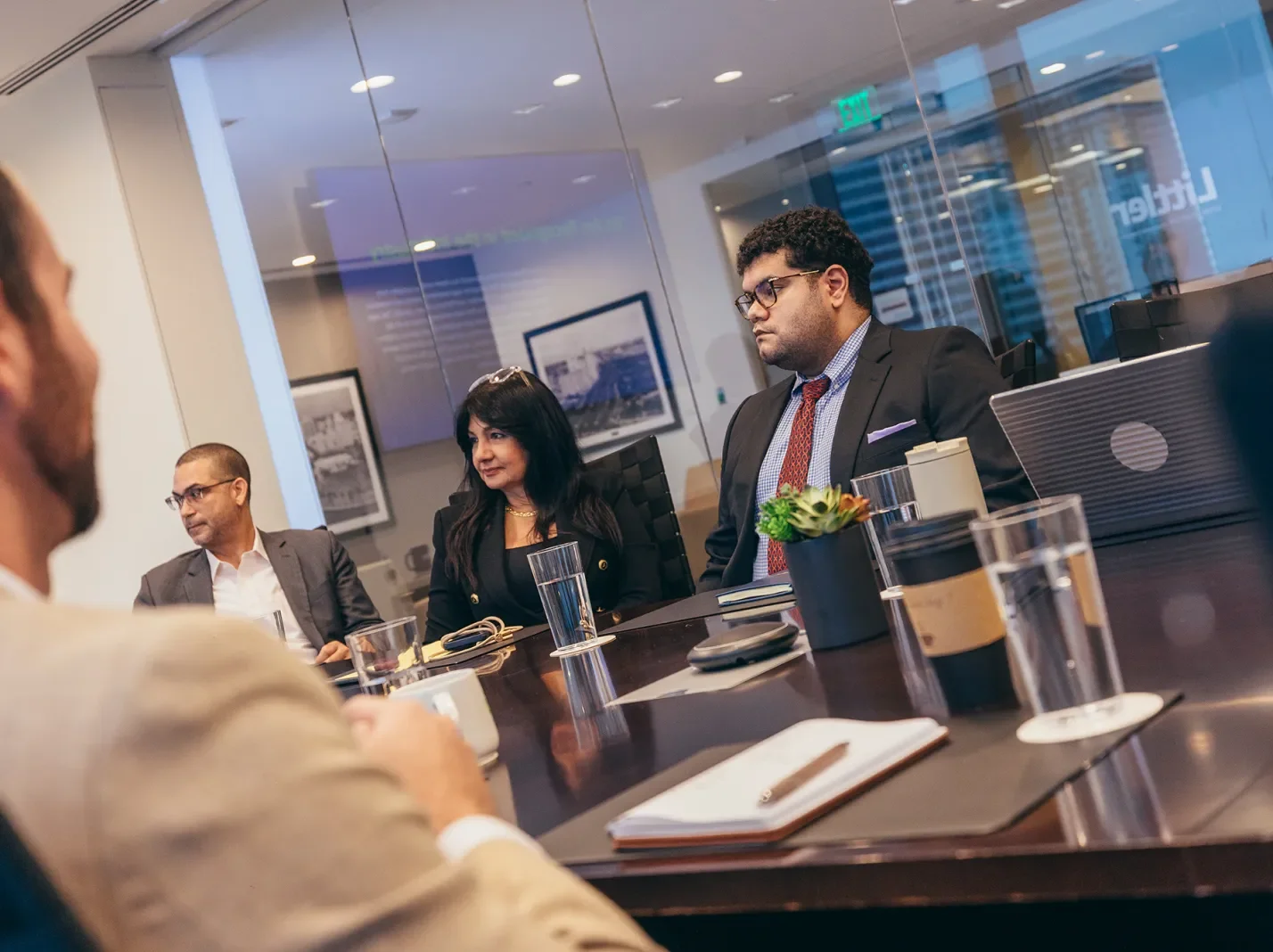 People in suits at a conference table